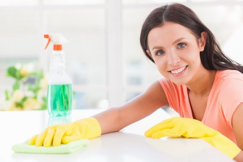 Carpet cleaning team applying safety controls during a service visit