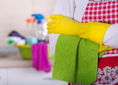 Operative handling cleaning products safely during carpet cleaning